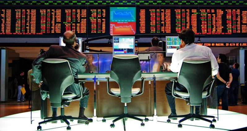 SEO Tips for Startups - strategy for international startups - two men sitting and watching stock exchange screens